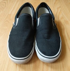 Vans black slip-ons